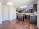 Kitchen featuring stainless steel appliances, dark brown cabinets, and hardwood floors at 1430 Eastway Dr, Dallas, NC 28034