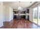 Kitchen featuring stainless steel appliances, dark brown cabinets, and hardwood floors at 1430 Eastway Dr, Dallas, NC 28034