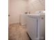 Convenient laundry room with modern washer, dryer, and shelving unit, ideal for organization at 1430 Eastway Dr, Dallas, NC 28034