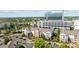 View of condos with parking and sidewalks and green trees on a sunny day at 14869 Santa Lucia Dr, Charlotte, NC 28277
