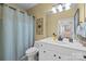 Bright bathroom features white fixtures, soft blue accents, and ample counter space at 14869 Santa Lucia Dr, Charlotte, NC 28277
