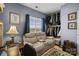 Bedroom featuring large window, sofa with recliners, rug and closet at 14869 Santa Lucia Dr, Charlotte, NC 28277