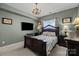 The bedroom has decorative furniture, soft carpet, and a stunning chandelier at 14869 Santa Lucia Dr, Charlotte, NC 28277