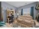 A room with a desk, comfortable seating and a large window provides a serene space to relax and enjoy the view at 14869 Santa Lucia Dr, Charlotte, NC 28277