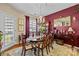 Beautiful dining room featuring large window, wood table with seating and ample natural light at 14869 Santa Lucia Dr, Charlotte, NC 28277