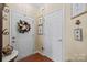 Inviting foyer with a wreath and beautiful decor on the walls at 14869 Santa Lucia Dr, Charlotte, NC 28277