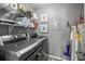 Well-equipped laundry room with modern appliances, shelving, and storage solutions at 14869 Santa Lucia Dr, Charlotte, NC 28277