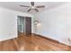 Bedroom with hardwood floors and access to the hallway at 1568 Cleveland Ave, Charlotte, NC 28203
