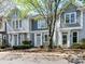 Charming townhouse exteriors feature neat landscaping, light blue/gray siding, and well-maintained curb appeal at 1568 Cleveland Ave, Charlotte, NC 28203
