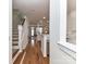 Bright foyer with hardwood floors, white trim, and an open staircase, offering a warm and inviting atmosphere at 1568 Cleveland Ave, Charlotte, NC 28203