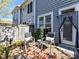 Charming patio area with outdoor seating, a privacy fence, and well-maintained landscaping at 1568 Cleveland Ave, Charlotte, NC 28203