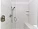 Close up of frameless tile shower with two shower heads and built in shelves at 1568 Cleveland Ave, Charlotte, NC 28203