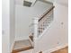 A wood staircase with white risers and wood handrail leads to the second floor at 1568 Cleveland Ave, Charlotte, NC 28203