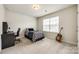 Cozy bedroom with large window for natural light and a carpeted floor at 1588 Trentwood Dr, Fort Mill, SC 29715