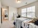 Bright bedroom with a study desk and chair in front of the window at 1588 Trentwood Dr, Fort Mill, SC 29715