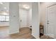 Bright foyer with neutral walls, wood floors, and convenient access to the kitchen at 1588 Trentwood Dr, Fort Mill, SC 29715