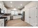 Bright kitchen featuring white cabinets, stainless steel appliances, and ample counter space at 1588 Trentwood Dr, Fort Mill, SC 29715