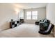 Spacious living room with plush carpeting, a comfortable couch, and entertainment center at 1588 Trentwood Dr, Fort Mill, SC 29715