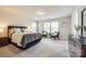Spacious main bedroom with sitting area, ensuite bathroom access, and carpeted floor at 1588 Trentwood Dr, Fort Mill, SC 29715