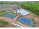 Aerial view of community recreational facilities including pool, clubhouse, and tennis courts at 1588 Trentwood Dr, Fort Mill, SC 29715