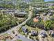 An aerial view of a neighborhood, highlighting well-maintained homes and lush green landscaping at 16636 Flintrock Falls Ln, Charlotte, NC 28278