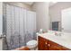Bathroom with a shower/tub combination and a dark wood vanity at 16636 Flintrock Falls Ln, Charlotte, NC 28278