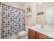 Bathroom with a shower/tub combination and a light wood vanity at 16636 Flintrock Falls Ln, Charlotte, NC 28278