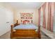 Cozy bedroom with a wooden bed frame, carpeting, and natural light at 16636 Flintrock Falls Ln, Charlotte, NC 28278