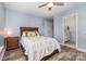 Comfortable bedroom with a wooden bed frame, ensuite bath, and neutral decor at 16636 Flintrock Falls Ln, Charlotte, NC 28278