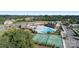 Community amenities including a pool, tennis courts, clubhouse and parking areas, set against a backdrop of trees at 16636 Flintrock Falls Ln, Charlotte, NC 28278