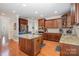 Kitchen with cherry cabinets, granite countertops, and stainless steel appliances at 16636 Flintrock Falls Ln, Charlotte, NC 28278
