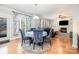 Comfortable dining area with a view of the living room and fireplace at 16636 Flintrock Falls Ln, Charlotte, NC 28278