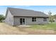 Backyard exterior showcasing gray siding, and a concrete patio, offering a charming outdoor space at 1706 30Th Avenue Ne Ct, Hickory, NC 28601