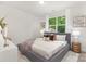 Bedroom with large window, plush bedding, and stylish side tables at 1706 30Th Avenue Ne Ct, Hickory, NC 28601