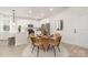 Bright dining area featuring white cabinets and stainless steel appliances at 1706 30Th Avenue Ne Ct, Hickory, NC 28601