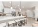Modern kitchen featuring a large island with seating, white cabinets, stainless steel appliances, and sleek design at 1706 30Th Avenue Ne Ct, Hickory, NC 28601