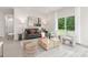 Modern living room with stylish seating, contemporary decor, and a large window showcasing the outdoors at 1706 30Th Avenue Ne Ct, Hickory, NC 28601