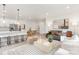Open concept living space with modern kitchen, cozy seating area, and dining space for seamless entertaining at 1706 30Th Avenue Ne Ct, Hickory, NC 28601