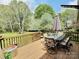 Inviting wooden deck with a dining set, ideal for outdoor entertaining and enjoying the backyard view at 171 Westmoreland Rd, Mooresville, NC 28115