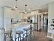 Spacious kitchen with a large island, granite countertops, stainless appliances and pendant lighting at 171 Westmoreland Rd, Mooresville, NC 28115