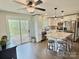Charming eat-in kitchen with stainless appliances, granite countertops, and backyard access at 171 Westmoreland Rd, Mooresville, NC 28115