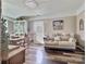 Cozy living room featuring hardwood floors, comfortable seating, and a dining area at 171 Westmoreland Rd, Mooresville, NC 28115