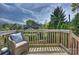 Inviting back deck with a comfortable chair and a view of the backyard at 1824 Hall Ave, Charlotte, NC 28205