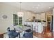 Bright and airy kitchen with modern white cabinets, granite countertops, and a charming breakfast bar with table at 1824 Hall Ave, Charlotte, NC 28205
