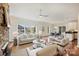 Open concept living space with stone fireplace and hardwood floors at 1824 Hall Ave, Charlotte, NC 28205