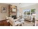 Bright living room featuring a stone fireplace and large window at 1824 Hall Ave, Charlotte, NC 28205