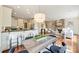 Open-concept living space featuring dining area, kitchen, and living room with a stone fireplace feature at 1824 Hall Ave, Charlotte, NC 28205