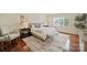 Main bedroom with hardwood floors, neutral décor, and lots of natural light at 1824 Hall Ave, Charlotte, NC 28205