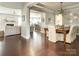 Open-concept dining and living area with hardwood floors and modern decor at 18721 Dumbarton Oaks Dr, Cornelius, NC 28031