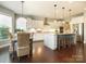 Bright, open kitchen and dining area with stainless steel appliances and hardwood flooring at 18721 Dumbarton Oaks Dr, Cornelius, NC 28031